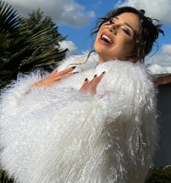 Merve Taskin in white fur dress