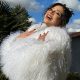 Merve Taskin in white fur dress