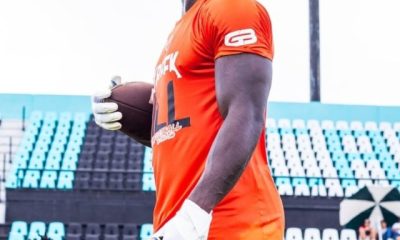 Tyreek Hill holding rugby ball