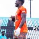 Tyreek Hill holding rugby ball